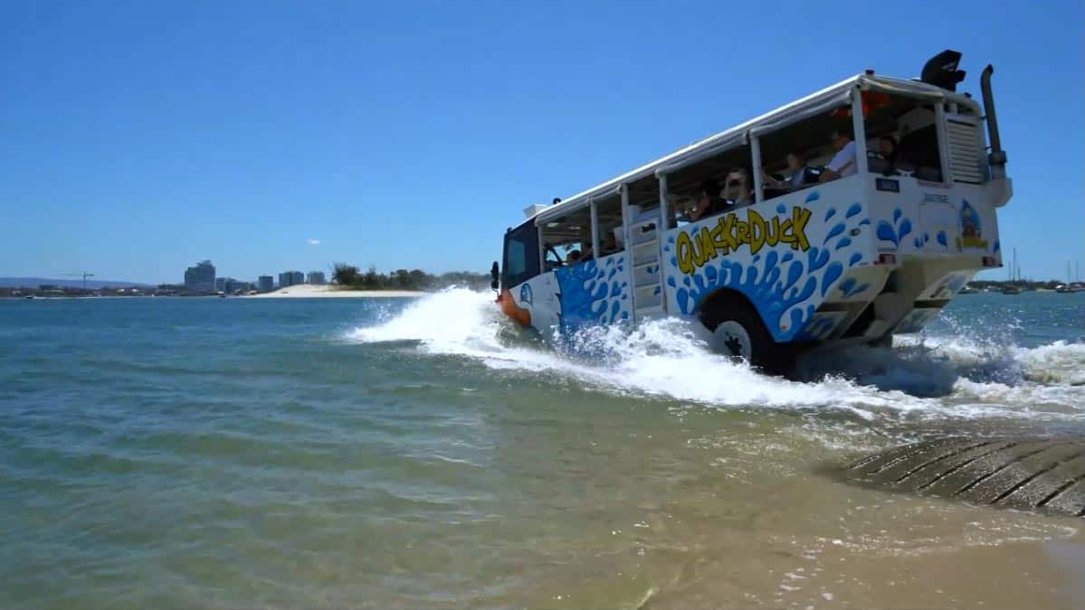 Duck bus driving into the water.